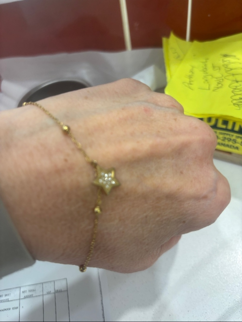 Gold Star Charm Bracelet with Crystal Accent